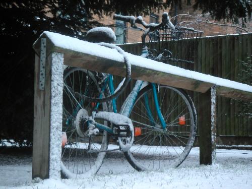 Snow-covered bicycle 